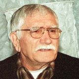 Перекошенный крест и портрет на земле: что случилось с могилой Джигарханяна